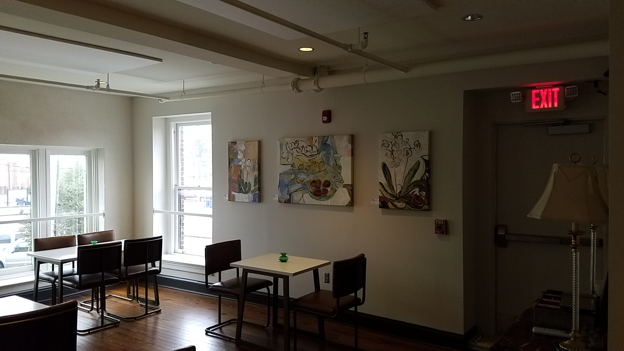the hackney dining area with paintings